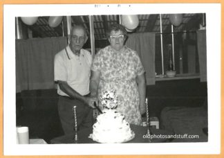 Old Couple Cutting Cake