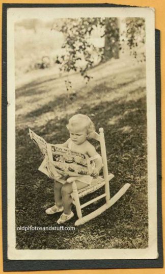 Little Girl Reading Newspaper